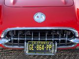 a close up of a red car with a license plate