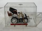 a small model of a car in a clear box