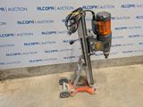 an image of a drill on a stand in front of a wall