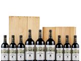 a group of bottles of wine sitting next to a wooden box
