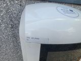 a microwave that is sitting on the side of a building