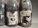 three bottles of wine sitting next to each other on a table