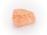 a close up of a rock on a white surface