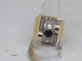 an image of a ring with a sapphire and diamonds