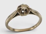 gros plan d'une bague en or avec un diamant au centre