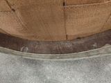 a close up view of a brown shoe on the ground