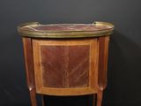 an image of a small wooden table with a leather top