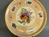 an image of a plate with flowers on it on a table