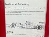 a red frame with a picture of a race car on it