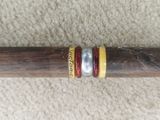 a cigar that is sitting on top of a wooden stick