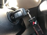 a keychain that is attached to a car seat belt
