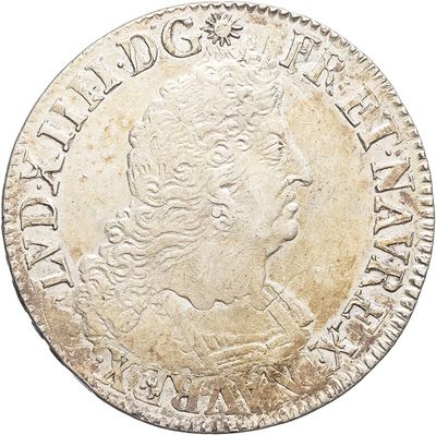 a silver coin with a woman ' s head on it