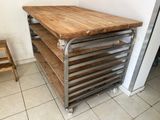 a wooden table with a metal frame on top of it