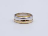 a close up of a ring on a white surface with a white background