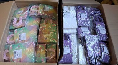 a box full of purple and green items in it