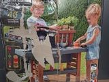 a box with a picture of a boy and a girl playing with a table