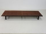 an image of a wooden bench sitting on top of a white floor