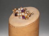 an image of a wooden box with a ring on top of it