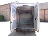 a white van with its door open on the street