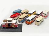 a lot of miniature buses that are lined up together