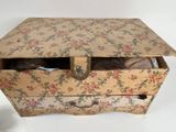 a small box with a cat inside of it