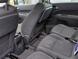 the back seats of a car are empty and the seats are empty