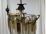 an image of a chandelier made of glass and brass