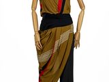 mannequin dressed in a brown and black dress with a red stripe