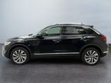 the black volkswagen suv is parked in the garage