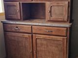 an old wooden cabinet in the corner of a room