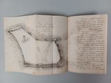 an open book with a drawing of a castle on it
