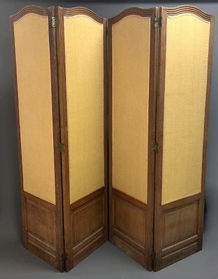 two tall wooden folding screen with beige fabric panels