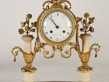 a clock that is sitting on top of a table