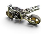 a motorcycle that is made out of metal and is sitting on a white surface