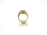 a close up of a gold ring on a white surface