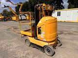 a yellow fork lift truck parked in a parking lot