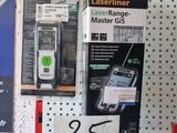 a display of cell phones on the wall in a store