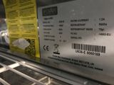 a label on the back of a refrigerator that says water current