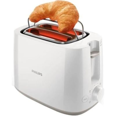 un grille-pain blanc sur lequel est posé un croissant