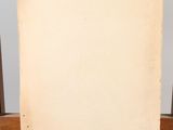 an old easel with a blank canvas on top of it