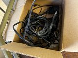 a cardboard box with a bunch of wires in it