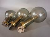 three light bulbs that are sitting on a table