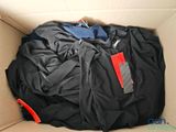 a box full of clothes and a cell phone in it