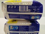 two packs of toilet paper sitting on top of each other