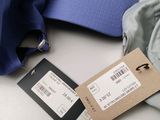 a blue hat and a blue hat with a tag on it