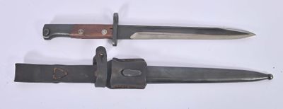 two knives are laying side by side on a white surface