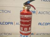 a red fire extinguisor sitting on a table