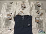 a lot of t - shirts and other items on the table