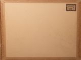 an old picture of a picture frame with a stamp on it