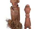 wooden figurines of a man and a woman standing next to each other